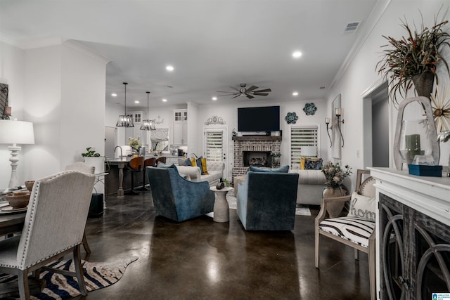 11967 Glen Ridge Blvd, Moundville, AL 35474 - living area with a brick fireplace, ceiling fan, concrete flooring, recessed lighting, and crown molding