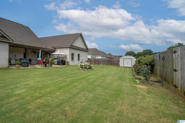 11967 Glen Ridge Blvd, Moundville, AL 35474 - fenced backyard with a storage shed and a patio area