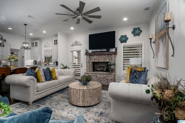 11967 Glen Ridge Blvd, Moundville, AL 35474 - living room featuring ceiling fan, ornamental molding, recessed lighting, and a fireplace