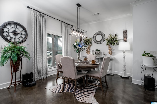 11967 Glen Ridge Blvd, Moundville, AL 35474 - dining space with concrete floors, crown molding, and a chandelier