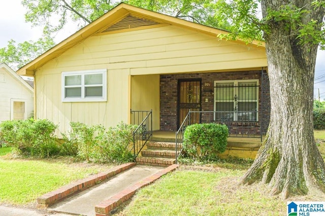 201 61st St, Fairfield, AL 35064 - view of front of property with covered porch and a front lawn