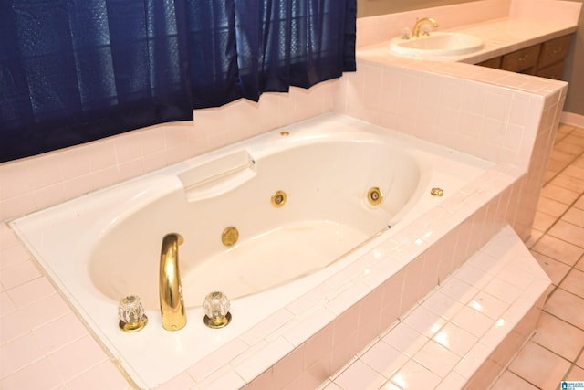 201 61st St, Fairfield, AL 35064 - bathroom with tile patterned floors and a tub with jets