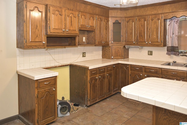 201 61st St, Fairfield, AL 35064 - kitchen with tasteful backsplash, tile countertops, and ornamental molding