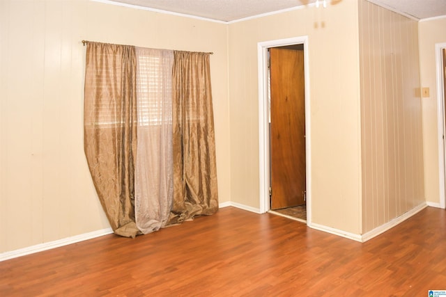 201 61st St, Fairfield, AL 35064 - unfurnished room with ornamental molding and wood finished floors