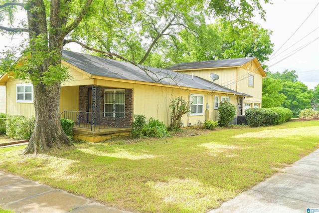 201 61st St, Fairfield, AL 35064 - view of side of home featuring a porch and a yard