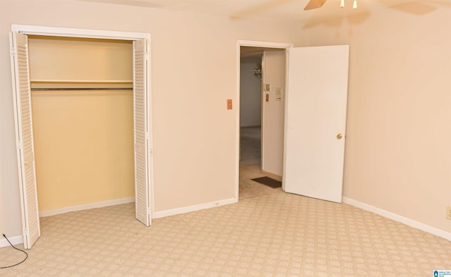 201 61st St, Fairfield, AL 35064 - unfurnished bedroom featuring a closet, ceiling fan, and carpet