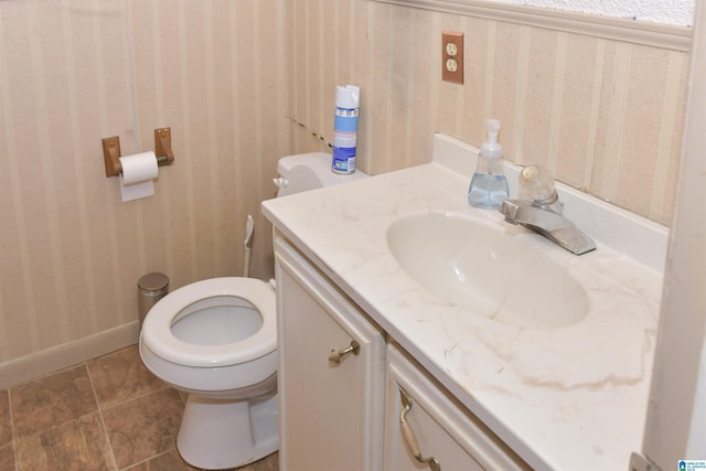201 61st St, Fairfield, AL 35064 - bathroom with vanity, wallpapered walls, and tile patterned flooring