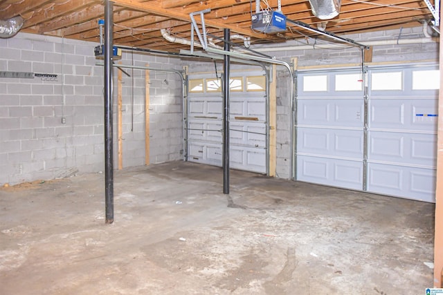 201 61st St, Fairfield, AL 35064 - garage with a garage door opener and concrete block wall