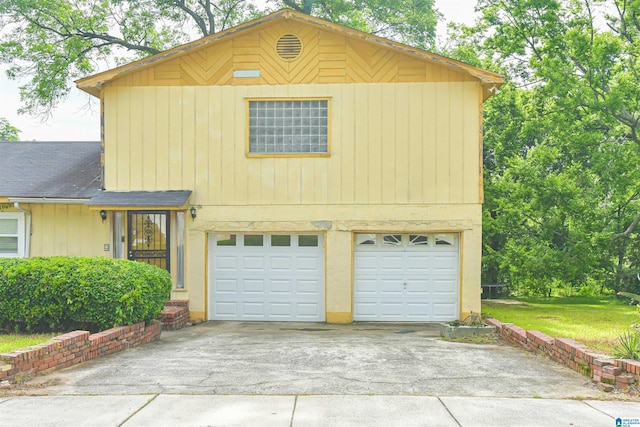 201 61st St, Fairfield, AL 35064 - view of front of home with a garage, concrete driveway, and a shingled roof