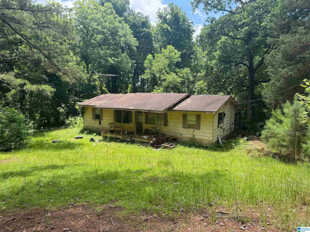 2525 Louina Rd, Roanoke, AL 36274 - view of front of house with covered porch and a forest view