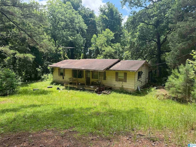 2525 Louina Rd, Roanoke, AL 36274 - view of front of house with covered porch and a forest view