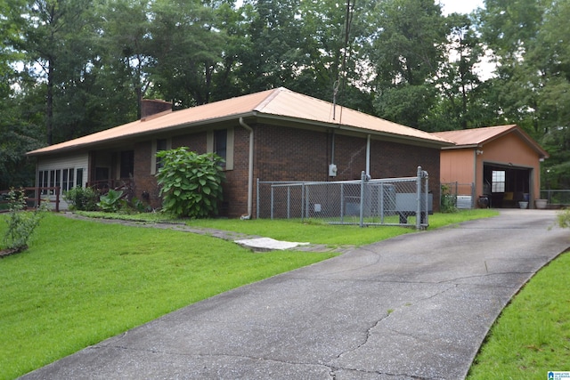 2641 Settlement Rd, Sylacauga, AL 35150 - view of front facade featuring an attached garage, a metal roof, and brick siding