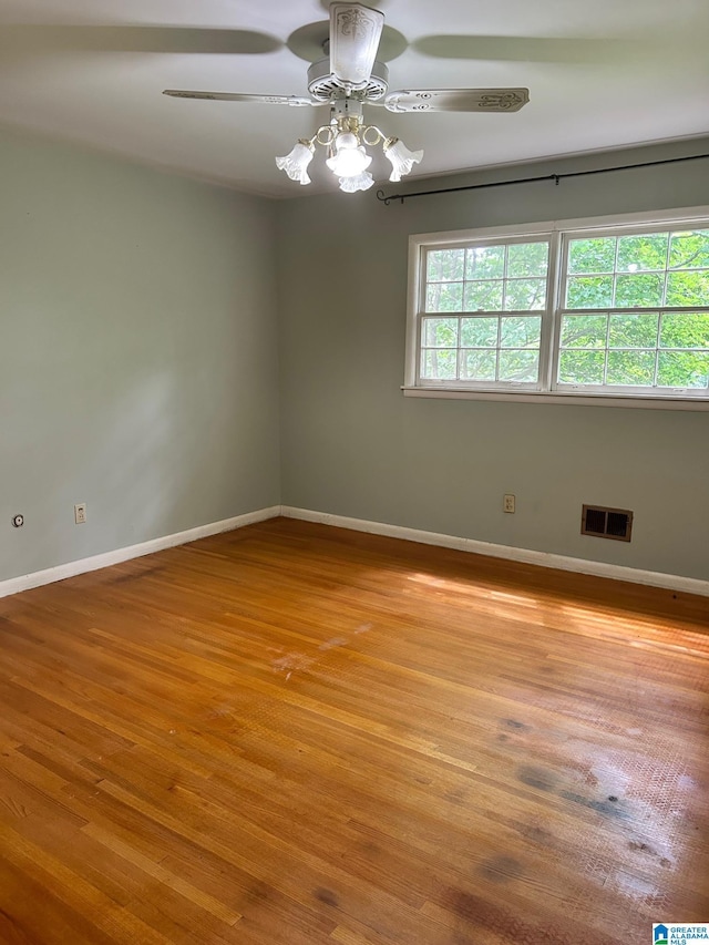 2341 Regent Ln, Hoover, AL 35226 - empty room with wood finished floors and a ceiling fan