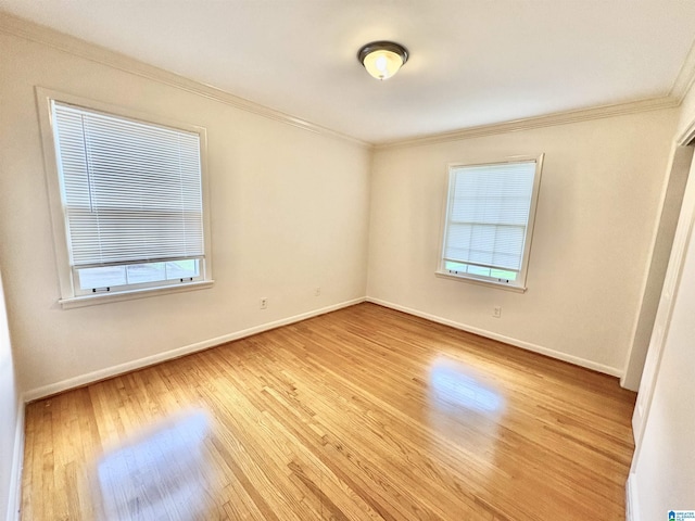 132 38th Ave NE, Center Point, AL 35215 - empty room with wood finished floors, healthy amount of natural light, and ornamental molding