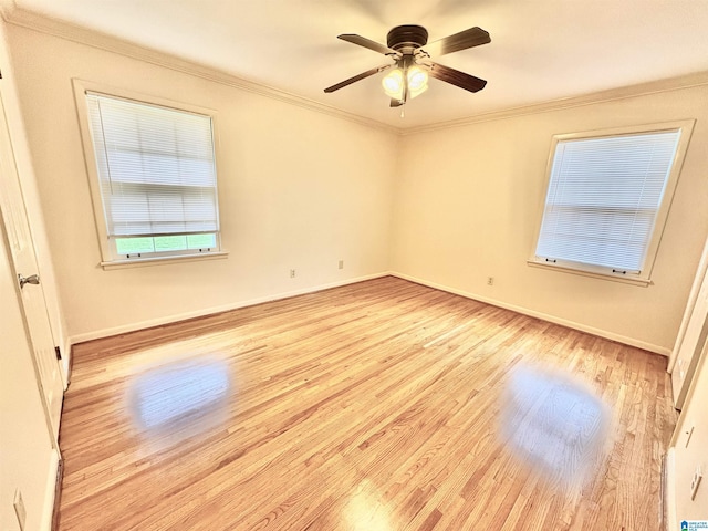 132 38th Ave NE, Center Point, AL 35215 - empty room featuring wood finished floors, ornamental molding, and a ceiling fan