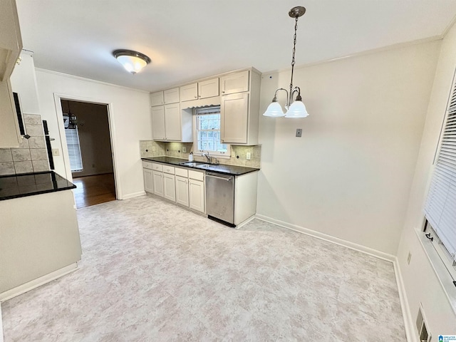 132 38th Ave NE, Center Point, AL 35215 - kitchen featuring dishwasher, decorative backsplash, dark countertops, ornamental molding, and a chandelier