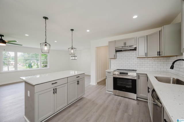 201 Sun Valley Rd, Center Point, AL 35215 - kitchen with stainless steel appliances, gray cabinets, decorative backsplash, light wood finished floors, and recessed lighting