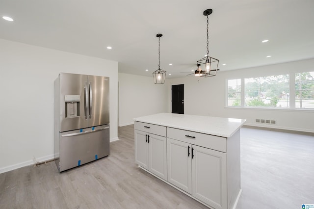 201 Sun Valley Rd, Center Point, AL 35215 - kitchen with stainless steel fridge, light wood finished floors, recessed lighting, light countertops, and decorative light fixtures