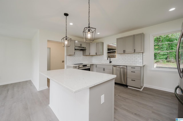 201 Sun Valley Rd, Center Point, AL 35215 - kitchen with appliances with stainless steel finishes, gray cabinetry, light wood finished floors, backsplash, and recessed lighting