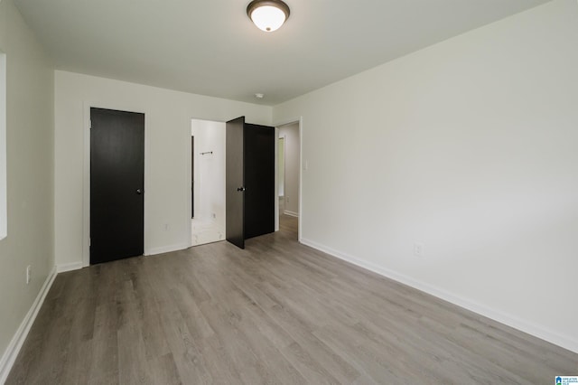 201 Sun Valley Rd, Center Point, AL 35215 - unfurnished bedroom featuring wood finished floors and baseboards