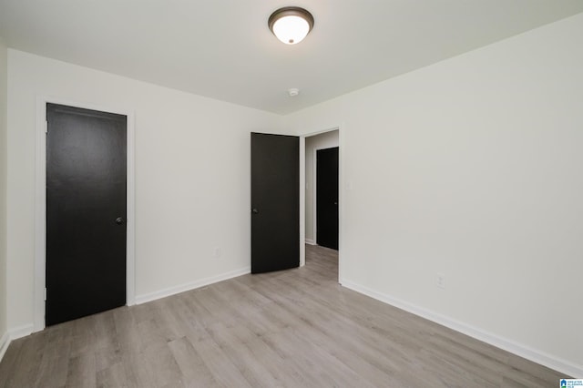 201 Sun Valley Rd, Center Point, AL 35215 - unfurnished bedroom with light wood finished floors and baseboards