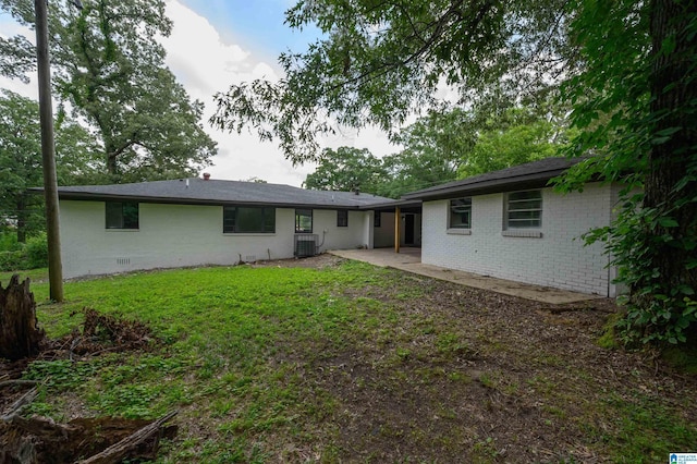 201 Sun Valley Rd, Center Point, AL 35215 - back of property featuring brick siding, a patio, crawl space, and a lawn