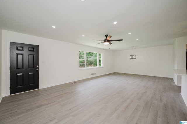 201 Sun Valley Rd, Center Point, AL 35215 - unfurnished living room with a ceiling fan, recessed lighting, light wood-style floors, and a chandelier