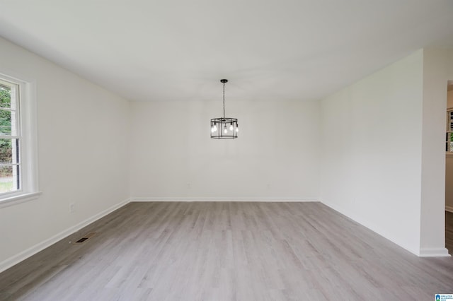 201 Sun Valley Rd, Center Point, AL 35215 - unfurnished dining area with healthy amount of natural light, wood finished floors, and a chandelier