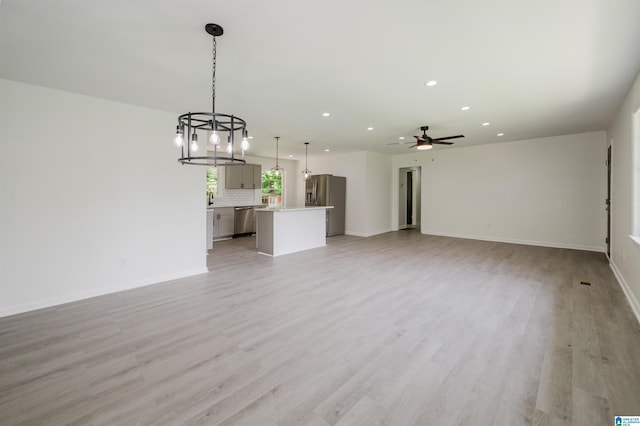 201 Sun Valley Rd, Center Point, AL 35215 - unfurnished living room with recessed lighting, a chandelier, light wood-type flooring, and a ceiling fan