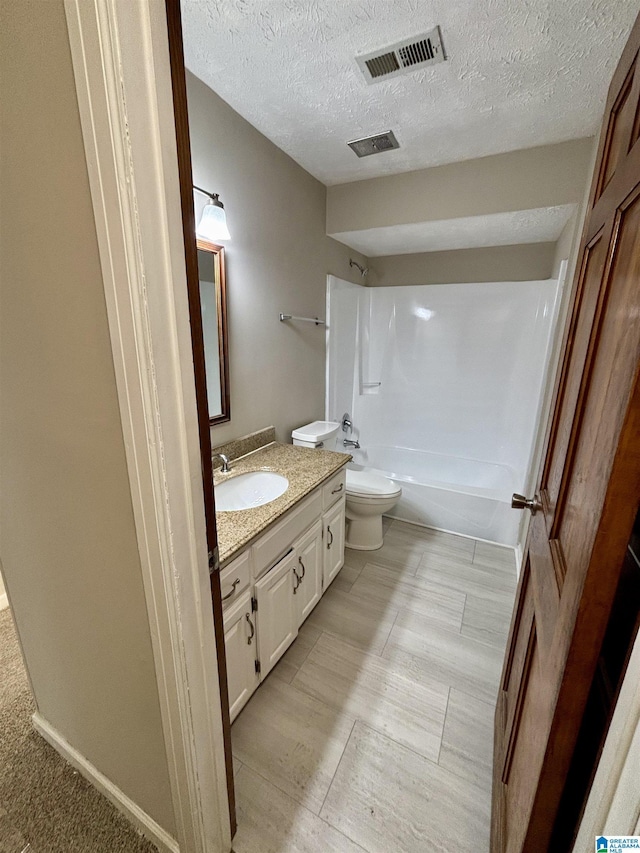 1221 Dalraida Rd, Montgomery, AL 36109 - full bathroom with vanity, tub / shower combination, and a textured ceiling