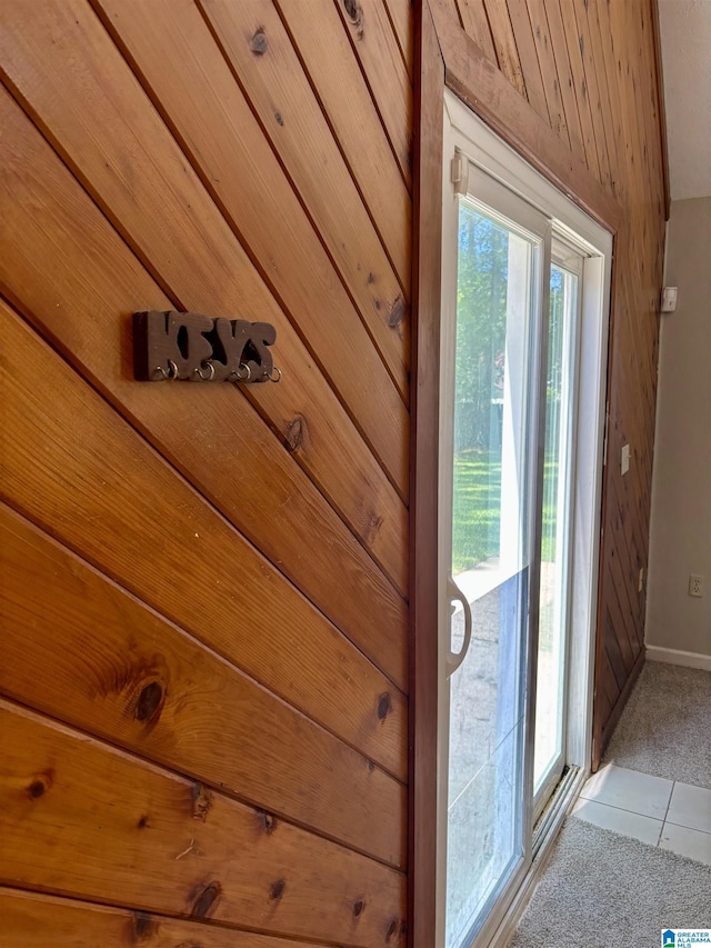 1221 Dalraida Rd, Montgomery, AL 36109 - doorway to outside with plenty of natural light, light colored carpet, and wood walls