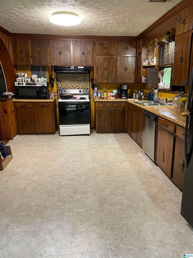 67 Evans Bridge Rd, Heflin, AL 36264 - kitchen featuring black appliances, range hood, a textured ceiling, ornamental molding, and light countertops