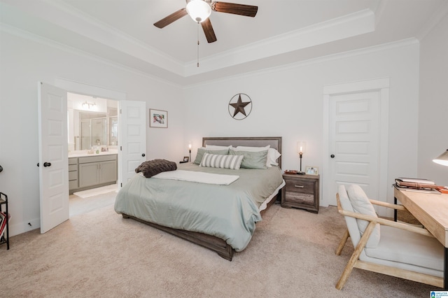 1268 Shades Ter, Irondale, AL 35210 - bedroom featuring a tray ceiling, light carpet, ornamental molding, connected bathroom, and ceiling fan
