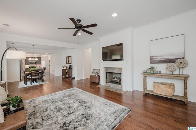 1268 Shades Ter, Irondale, AL 35210 - living area featuring wood finished floors, ceiling fan, ornamental molding, a tile fireplace, and recessed lighting