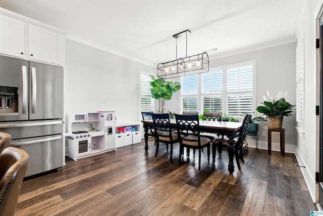 4855 Bo Run, Trussville, AL 35173 - dining room featuring crown molding, healthy amount of natural light, dark wood-style floors, and a chandelier