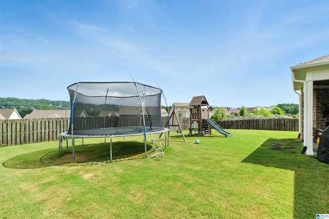 4855 Bo Run, Trussville, AL 35173 - fenced backyard featuring a trampoline and a playground