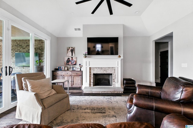 4855 Bo Run, Trussville, AL 35173 - living area featuring wood finished floors, a ceiling fan, a fireplace, and vaulted ceiling