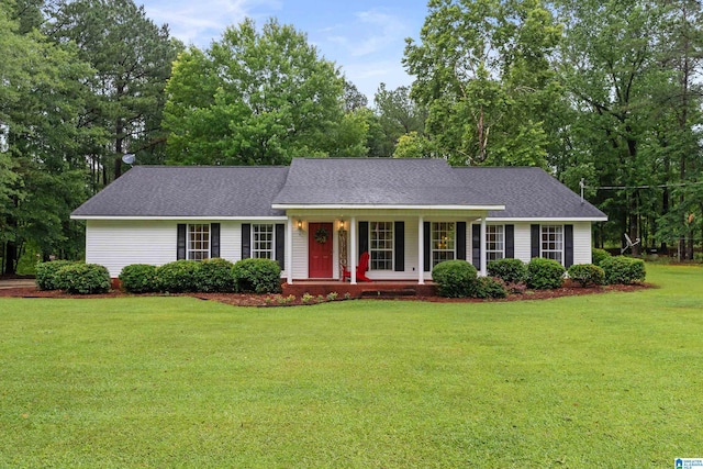 2690 Ingate Pass, Centreville, AL 35042 - view of front of property with a porch, a front yard, roof with shingles, and view of wooded area