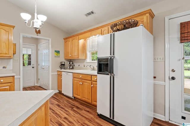 2690 Ingate Pass, Centreville, AL 35042 - kitchen with white appliances, lofted ceiling, a chandelier, light countertops, and wood finished floors
