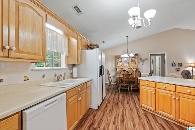 2690 Ingate Pass, Centreville, AL 35042 - kitchen featuring white appliances, a chandelier, wood finished floors, vaulted ceiling, and hanging light fixtures