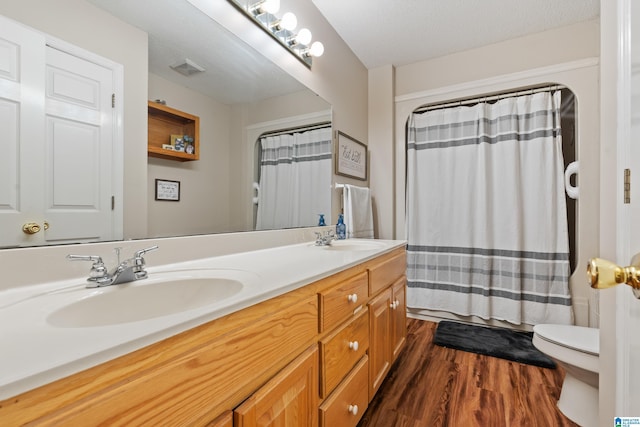2690 Ingate Pass, Centreville, AL 35042 - bathroom with double vanity, wood finished floors, and a shower with curtain