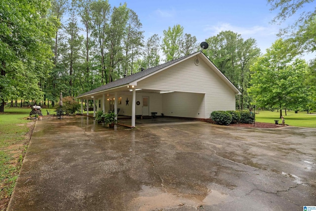 2690 Ingate Pass, Centreville, AL 35042 - view of property exterior with asphalt driveway and a carport