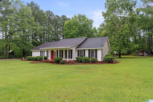 2690 Ingate Pass, Centreville, AL 35042 - ranch-style home featuring a front yard, roof with shingles, covered porch, and view of scattered trees