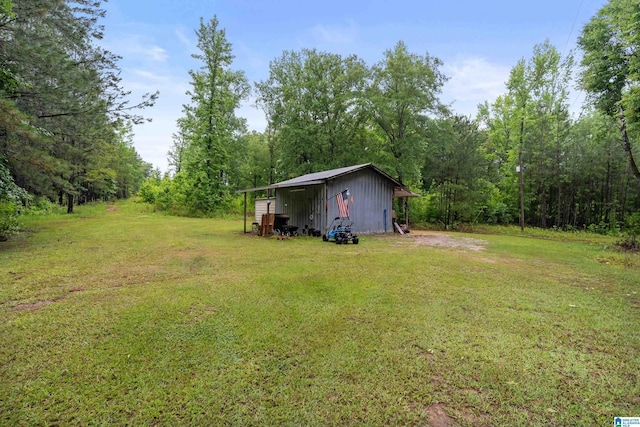 2690 Ingate Pass, Centreville, AL 35042 - view of green lawn with an outdoor structure, a view of trees, and an outbuilding