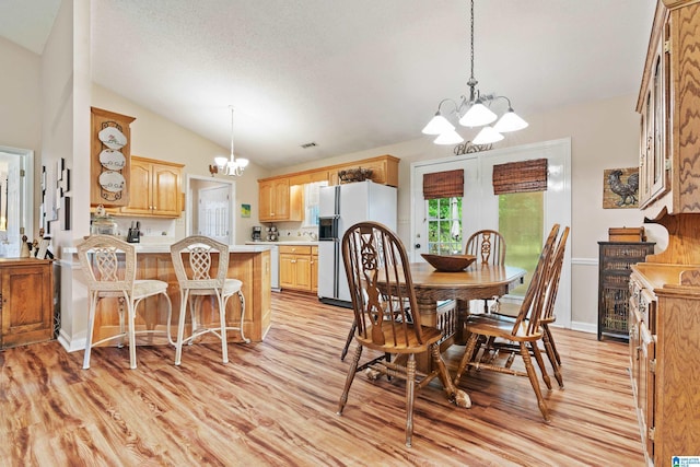 2690 Ingate Pass, Centreville, AL 35042 - dining room featuring a chandelier, light wood finished floors, and lofted ceiling