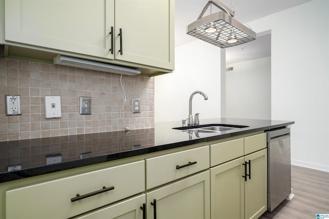 401 20th St S Unit 126, Birmingham, AL 35233 - kitchen featuring dishwasher, light wood-style floors, and tasteful backsplash