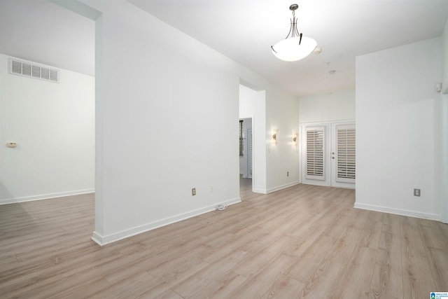 401 20th St S Unit 126, Birmingham, AL 35233 - empty room featuring light wood finished floors and french doors