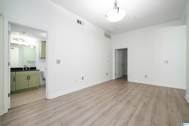 401 20th St S Unit 126, Birmingham, AL 35233 - unfurnished room with light wood-style floors and a sink