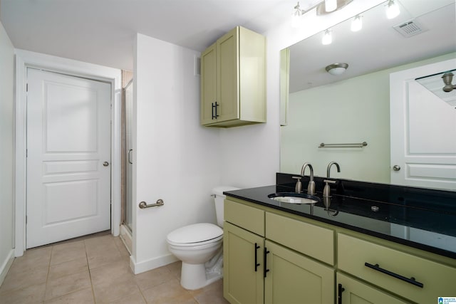 401 20th St S Unit 126, Birmingham, AL 35233 - bathroom featuring vanity, a stall shower, and tile patterned flooring
