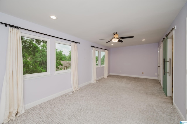 3655 Haven View Cir, Hoover, AL 35216 - empty room featuring ceiling fan, recessed lighting, light colored carpet, and a barn door